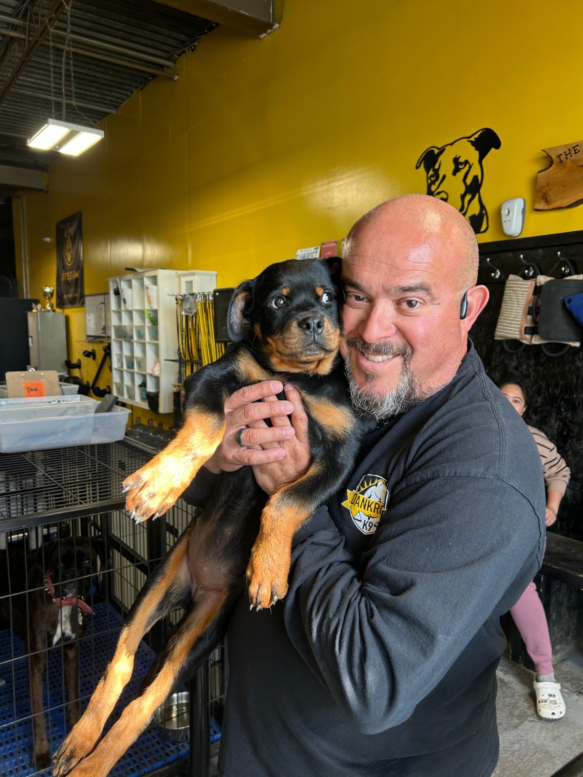 Dan of DankroftK9 holding a puppy